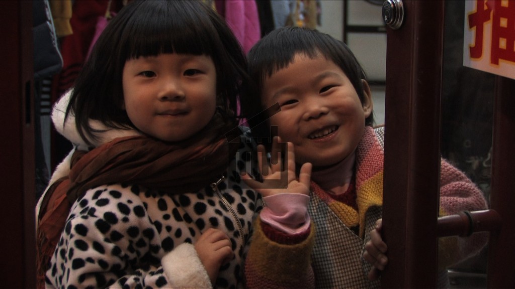 Des enfants dans les rues de Pékin